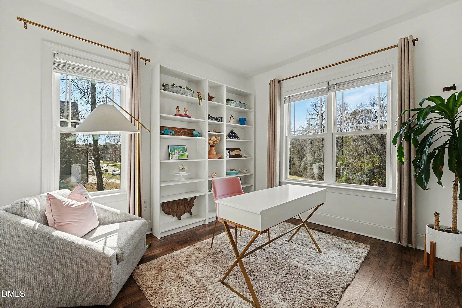 Sophisticated home office with built-in shelving and natural light