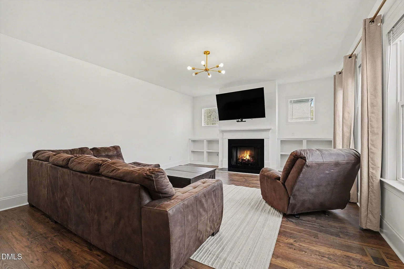 Cozy living area with fireplace and built-in entertainment center