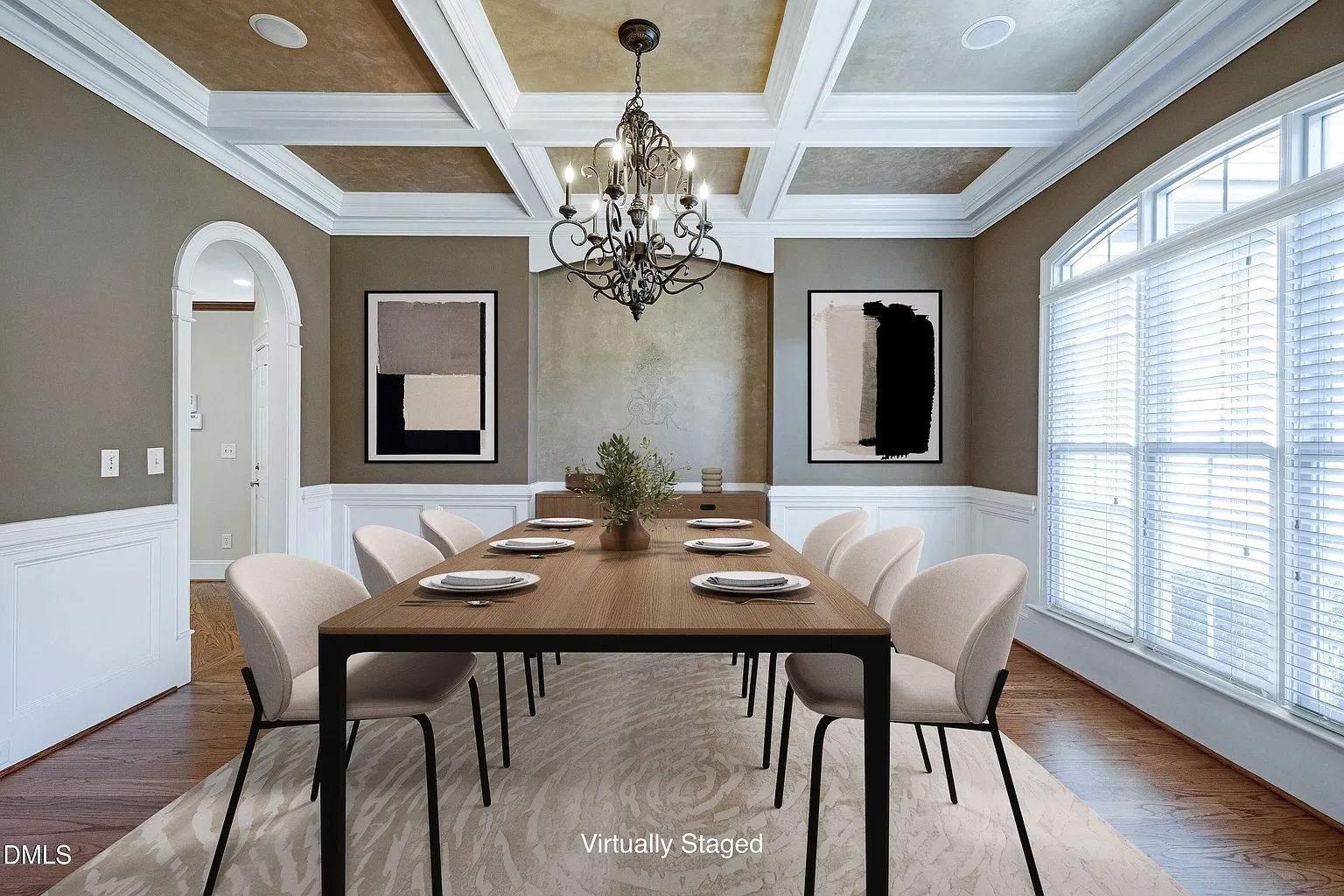 Formal dining room featuring elegant coffered ceiling design