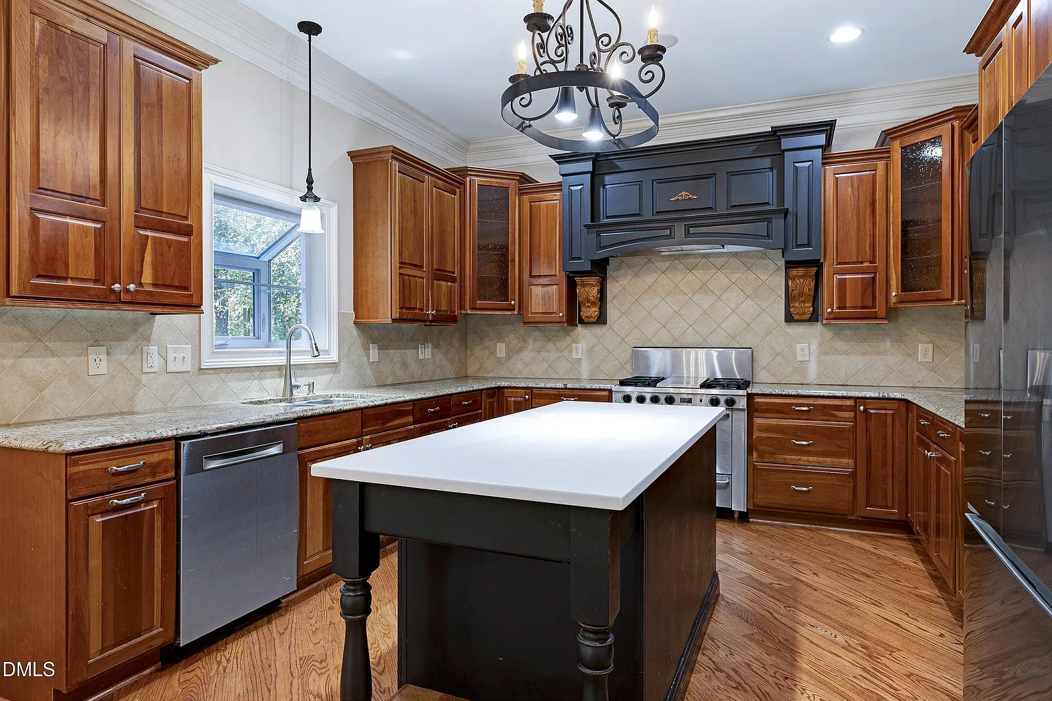 Gourmet kitchen with custom cabinetry and center island