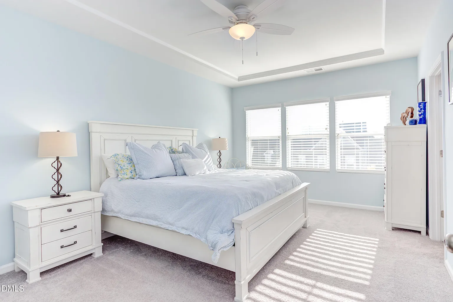 Serene master suite with abundant natural light