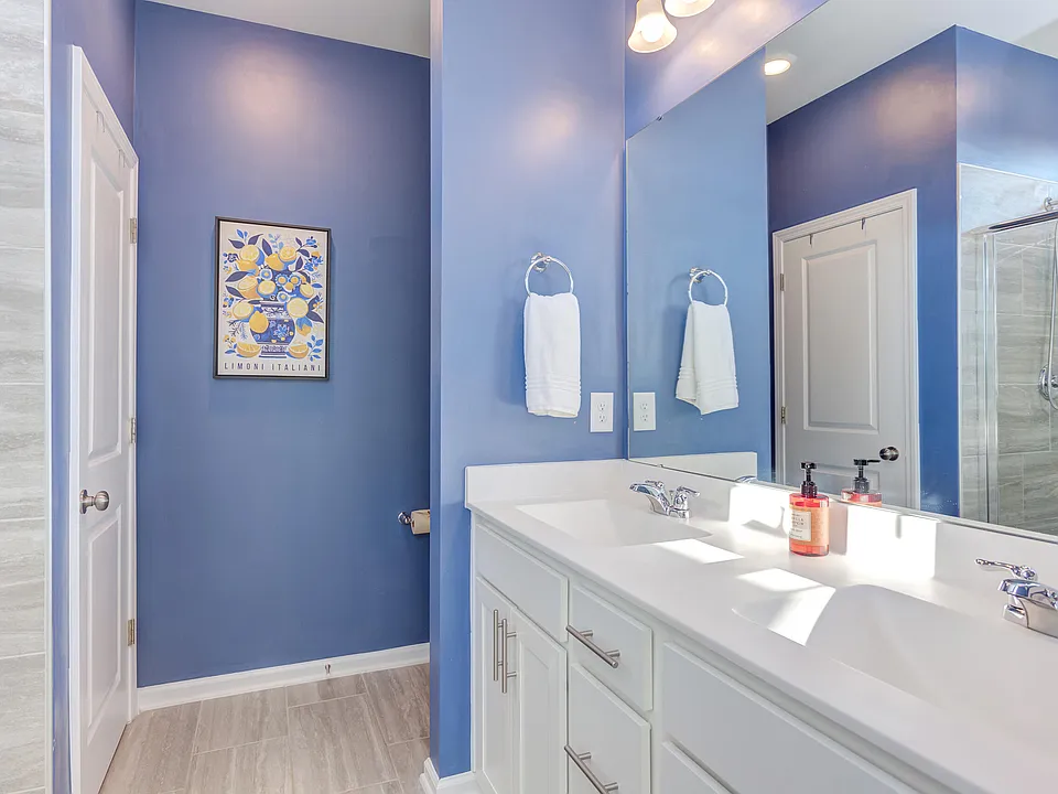 Vibrant bathroom featuring bold blue accent walls