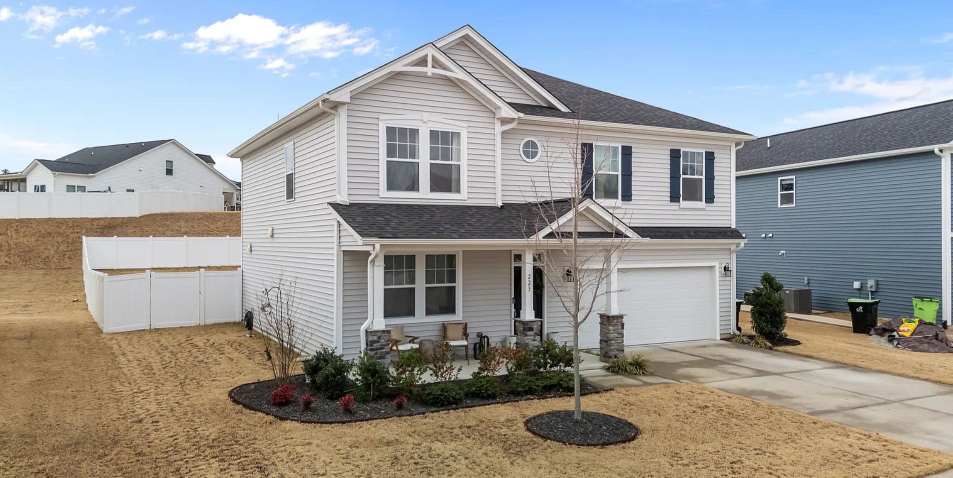 Elegant side elevation showcasing architectural details and mature plantings