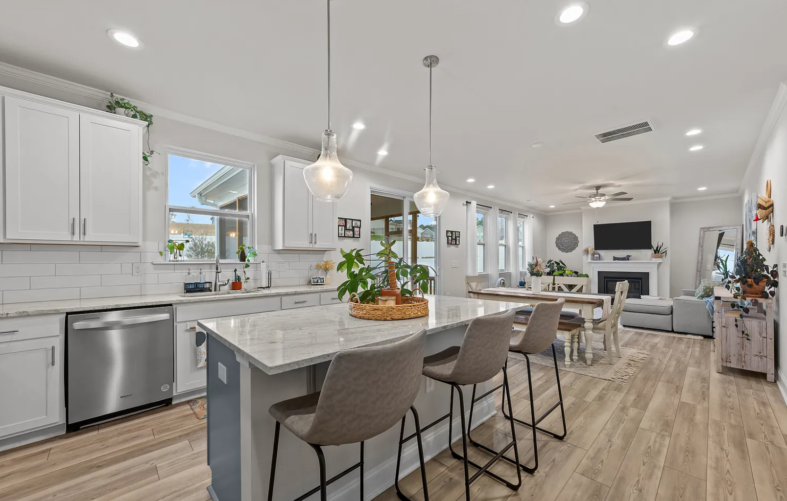 Seamless kitchen-to-living flow with abundant natural light throughout