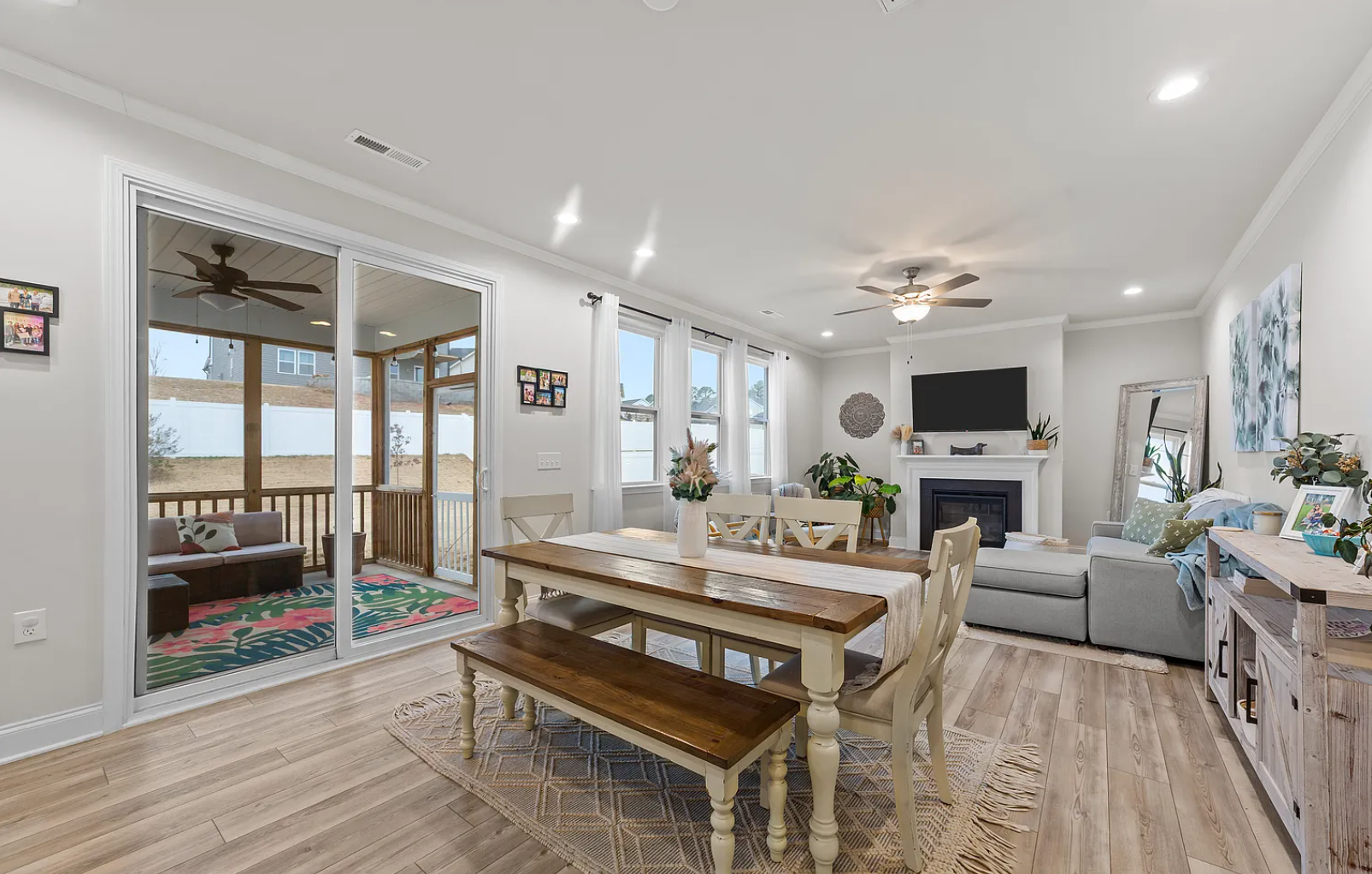 Open-concept dining area with sliding doors to covered deck