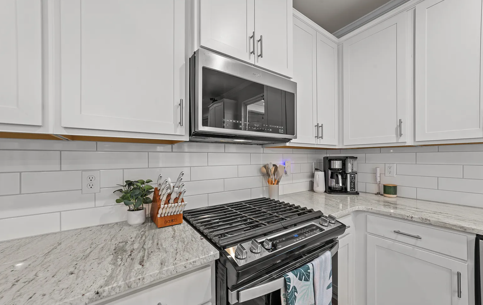 Chef-inspired kitchen with premium appliances and subway tile backsplash