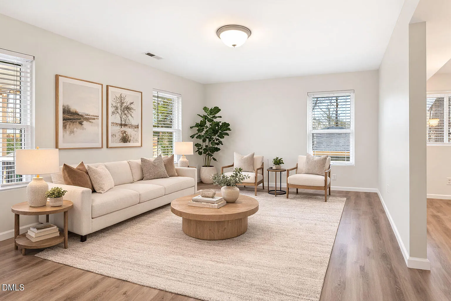 Sun-drenched living room with elegant neutral furnishings