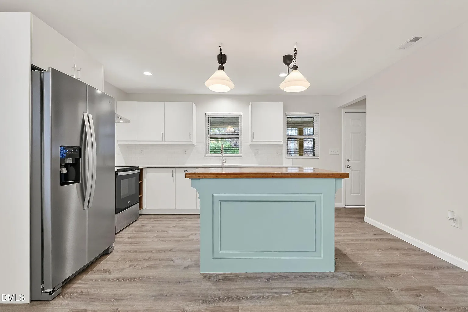 Modern kitchen featuring sleek island and premium finishes