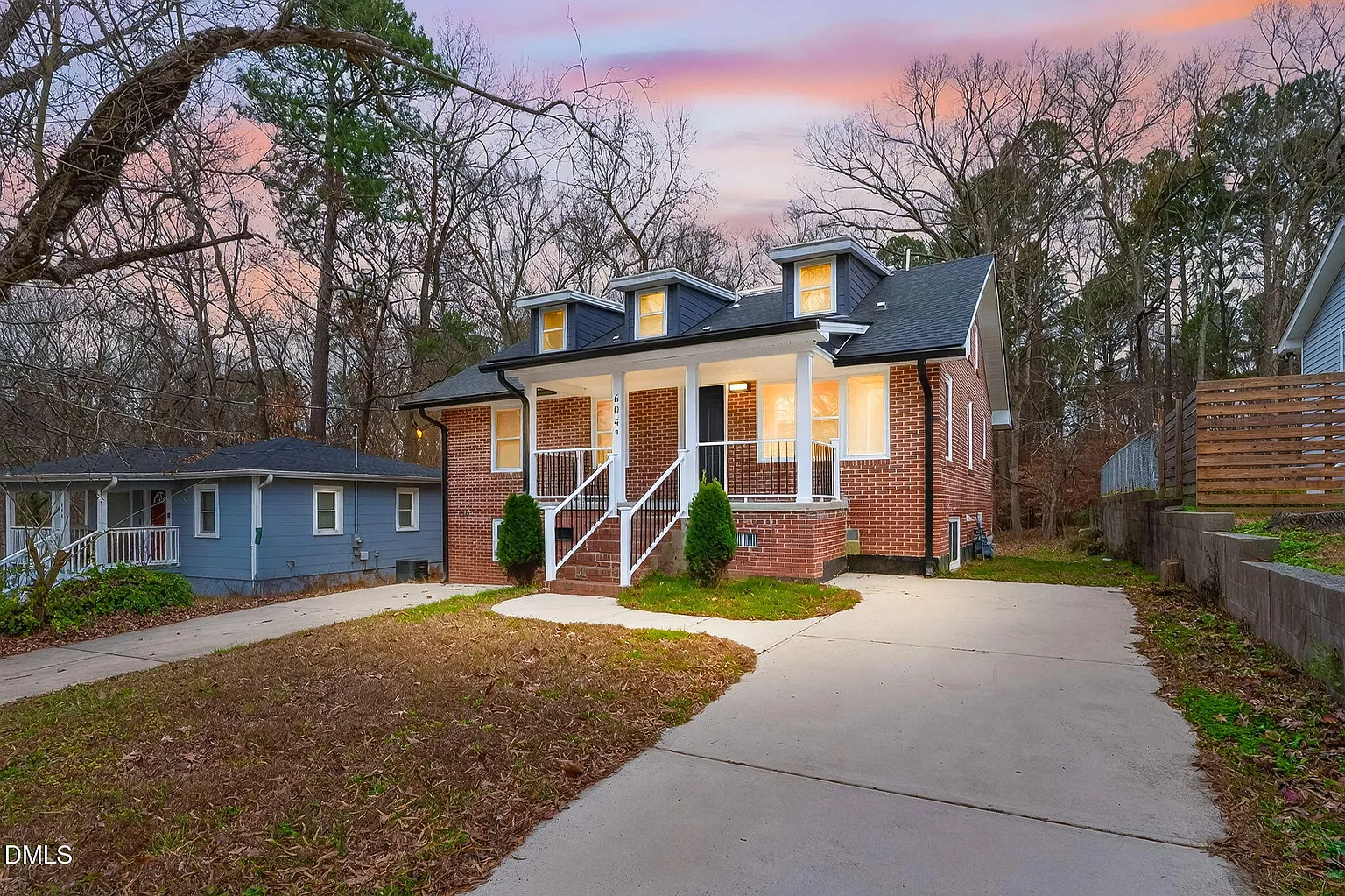 Charming brick exterior with welcoming covered front porch
